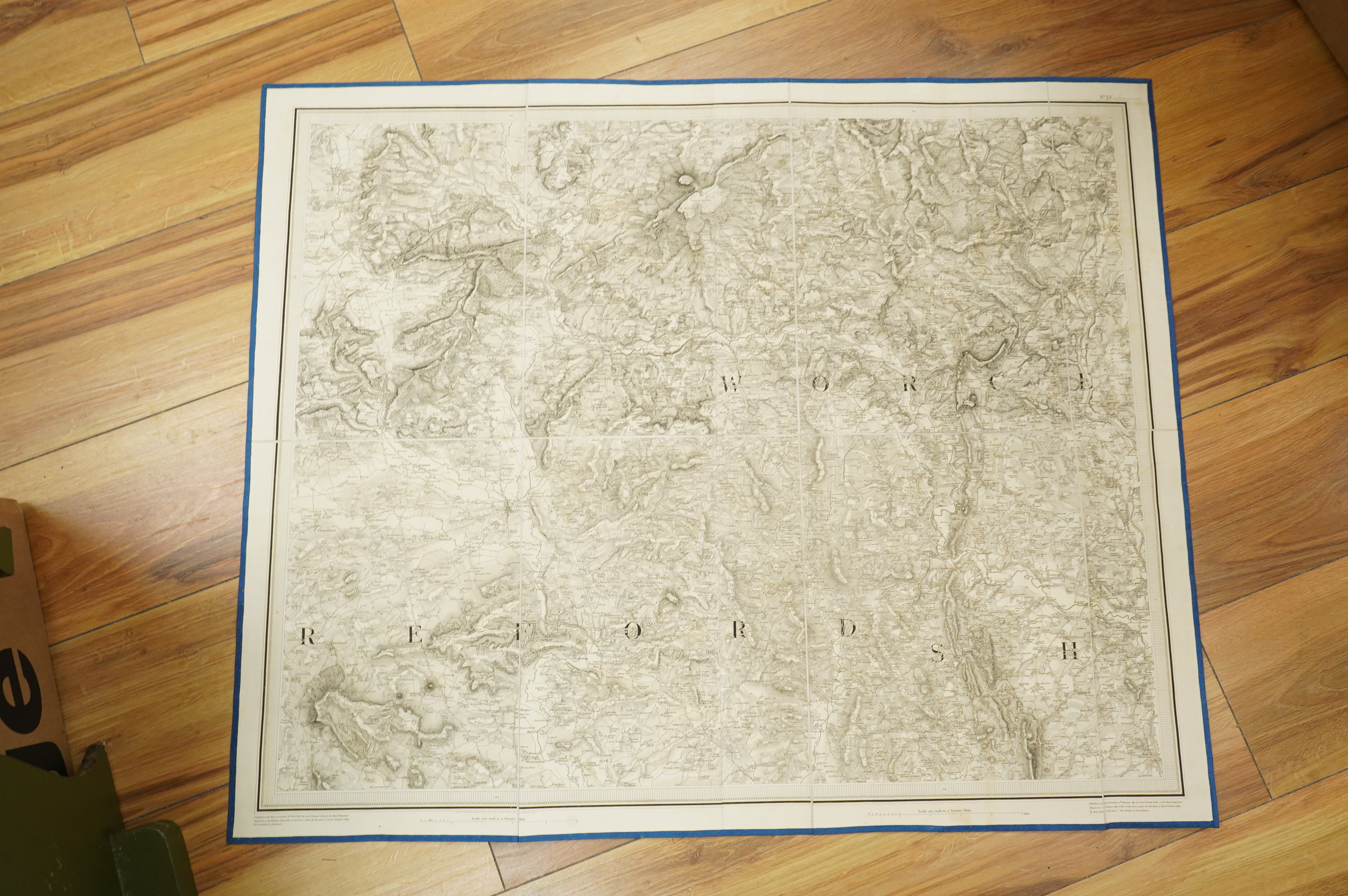Ordnance Survey maps, comprising of a set of seven engraved maps mounted on linen and each edged with blue cotton, covering Cardigan, Montgomery, S. Salop, S. Stafford, N. Warwick, Leicester, and Rutland, sheet no.s; 55,